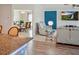 Inviting living room featuring a granite countertop, and dining room with stylish lighting at 5457 Leslie Canyon Dr, Wimauma, FL 33598
