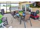 Screened-in patio features a hot tub, outdoor seating, and a TV for entertainment at 5457 Leslie Canyon Dr, Wimauma, FL 33598
