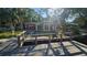 Waterfront property with a dock, backyard, and kayaks at 6 Sea S Ln, St Petersburg, FL 33705