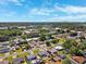 Aerial view of neighborhood with lots of landscaping and nearby amenities at 6010 Blossom Ave, Tampa, FL 33614