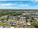 Picture of a neighborhood showcasing single-Gathering homes with pools and mature trees in a scenic environment at 6010 Blossom Ave, Tampa, FL 33614