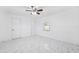 Bright bedroom featuring tile flooring, a ceiling fan and ample light at 6010 Blossom Ave, Tampa, FL 33614