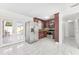 Kitchen features stainless steel appliances, wood cabinets, and granite countertops at 6010 Blossom Ave, Tampa, FL 33614