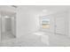 Bright living room showcasing tile floors and a neutral color palette at 6010 Blossom Ave, Tampa, FL 33614