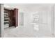 Bright living room showcasing tile floors and a neutral color palette at 6010 Blossom Ave, Tampa, FL 33614