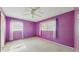 Bright bedroom features light carpet, two windows with blinds and curtains and a ceiling fan at 623 Park Cir # 623, Bradenton, FL 34207