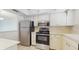 Efficient kitchen featuring stainless steel appliances and ample cabinet space at 623 Park Cir # 623, Bradenton, FL 34207