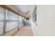 Enclosed tiled patio featuring large windows with blinds, a ceiling fan, and laundry hookups at 623 Park Cir # 623, Bradenton, FL 34207