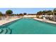 Inviting community pool surrounded by lounge chairs, tables and well-maintained landscaping at 623 Park Cir # 623, Bradenton, FL 34207