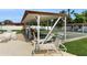 Community shuffleboard court under covered patio, offering outdoor leisure and social activities at 623 Park Cir # 623, Bradenton, FL 34207
