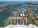 Stunning aerial view of a condo community with waterfront access and beautiful coastal scenery at 690 Island Way # 1011, Clearwater Beach, FL 33767