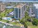 Aerial view of community showcasing pool, marina, and proximity to the water and nearby beaches at 690 Island Way # 1011, Clearwater Beach, FL 33767