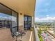 Relax on this covered condo balcony with seating and unobstructed panoramic views of the water at 690 Island Way # 1011, Clearwater Beach, FL 33767
