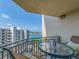 Cozy balcony features an outdoor table with seating and stunning views of the intercoastal waterway at 690 Island Way # 1011, Clearwater Beach, FL 33767