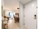 Inviting condo foyer leads to a combined dining and living area with beautiful tile floors at 690 Island Way # 1011, Clearwater Beach, FL 33767
