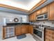Modern kitchen features stainless steel appliances and a convenient layout open to the living area at 690 Island Way # 1011, Clearwater Beach, FL 33767