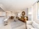 Open living room featuring dining area, bar seating, and balcony access at 690 Island Way # 1011, Clearwater Beach, FL 33767