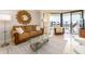 Inviting living room showcases stylish decor, comfortable sofa and balcony access at 690 Island Way # 1011, Clearwater Beach, FL 33767