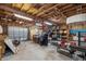 Spacious garage interior with exposed wood beam ceiling and open layout at 7247 Oelsner St, New Port Richey, FL 34652