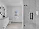 Modern bathroom with sleek vanity, glass-enclosed shower with white subway tile at 8262 26Th N Ave, St Petersburg, FL 33710
