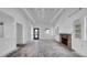 Bright living room with wood ceiling beams, brick fireplace, and modern finishes at 8262 26Th N Ave, St Petersburg, FL 33710