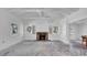 Bright living room with exposed beam ceiling, brick fireplace, and ample natural light at 8262 26Th N Ave, St Petersburg, FL 33710