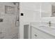 Updated bathroom with marble countertop, stand-up shower, and built-in shelving at 9155 125Th St, Seminole, FL 33772