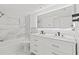 Modern bathroom featuring a double sink vanity, and white marble tile in the shower and backsplash at 9155 125Th St, Seminole, FL 33772