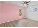 Bedroom features wood-look floors, ceiling fan and good natural light at 9155 125Th St, Seminole, FL 33772