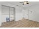 Comfortable bedroom with closet, ceiling fan, and wood-look flooring at 9155 125Th St, Seminole, FL 33772