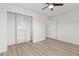 This bedroom includes wood-look floors, ceiling fan and built in closet at 9155 125Th St, Seminole, FL 33772