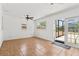 Bright bonus room featuring neutral walls, tile flooring, fan and a sliding glass door that provides natural light at 9155 125Th St, Seminole, FL 33772