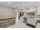Updated kitchen features white cabinets, stainless appliances and access to the living room at 9155 125Th St, Seminole, FL 33772