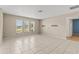 Spacious living room with tile flooring and ample natural light from the three large windows at 9155 125Th St, Seminole, FL 33772