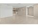 Open floor plan features a large living area with tiled floors and neutral paint at 9155 125Th St, Seminole, FL 33772