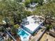 A captivating aerial view of the property showcasing its sparkling pool, lush landscaping, and spacious outdoor living areas at 920 16Th Sw Ave, Largo, FL 33770