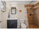 This bathroom features a tiled shower with a glass door, a vanity, and updated lighting at 920 16Th Sw Ave, Largo, FL 33770