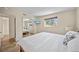 This bedroom has wood floors, white walls, and a mirrored closet at 920 16Th Sw Ave, Largo, FL 33770