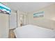 This is a clean bedroom with mirror closet doors and beach themed decor at 920 16Th Sw Ave, Largo, FL 33770