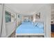 This bedroom features two beds, a mounted television, and ample lighting at 920 16Th Sw Ave, Largo, FL 33770