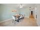 This dining room features a modern table, tile flooring and bright light fixtures at 920 16Th Sw Ave, Largo, FL 33770
