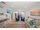 Comfortable living room featuring modern decor, stylish seating, and seamless indoor-outdoor transition at 920 16Th Sw Ave, Largo, FL 33770