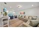 Bright and airy living room with stylish furniture, a cozy sectional sofa, and an adjacent outdoor view at 920 16Th Sw Ave, Largo, FL 33770