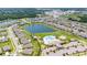 Aerial view of neighborhood amenities including a pool, lake, playground, and pickleball courts at 9907 Spanish Lime Ct, Riverview, FL 33578