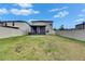 Fenced backyard features a screened patio, offering privacy and a great outdoor space at 9907 Spanish Lime Ct, Riverview, FL 33578