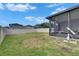 Spacious backyard with a screened-in patio for outdoor enjoyment at 9907 Spanish Lime Ct, Riverview, FL 33578