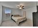 Bedroom featuring a ceiling fan, a window with blinds and neutral colored walls at 9907 Spanish Lime Ct, Riverview, FL 33578