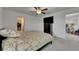 Bedroom featuring a floral bedspread, walk-in closet and ceiling fan at 9907 Spanish Lime Ct, Riverview, FL 33578