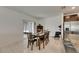 Bright dining room with a view through sliding glass doors at 9907 Spanish Lime Ct, Riverview, FL 33578