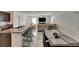 Open kitchen with barstool seating and a view into the living room and dining room at 9907 Spanish Lime Ct, Riverview, FL 33578
